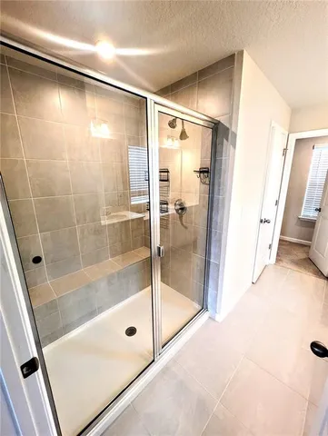 a bathroom with a double vanity sink and mirror