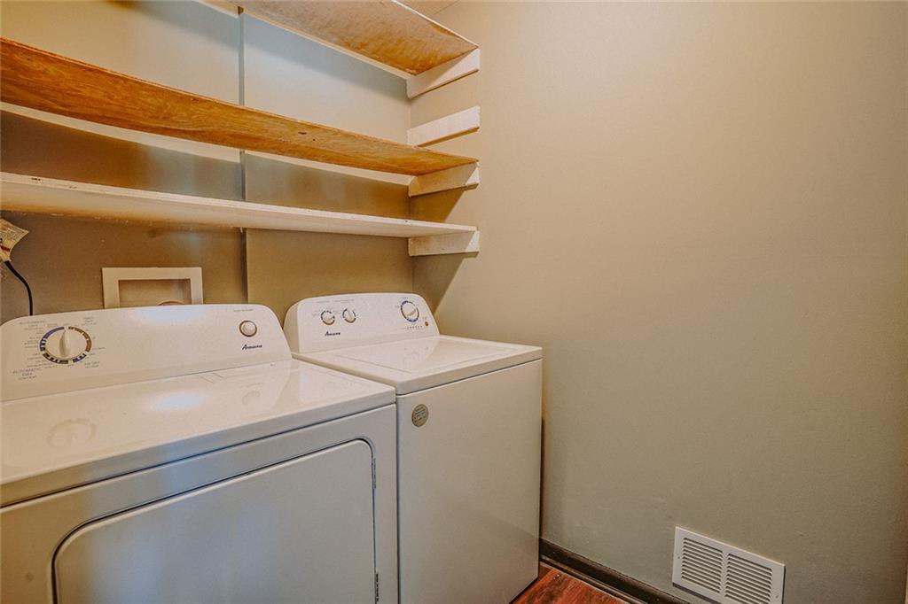 2877 Whispering Hills Drive, Unit 2877 Atlanta, GA 30341 - Photo 14 of 17 a utility room with dryer and washer