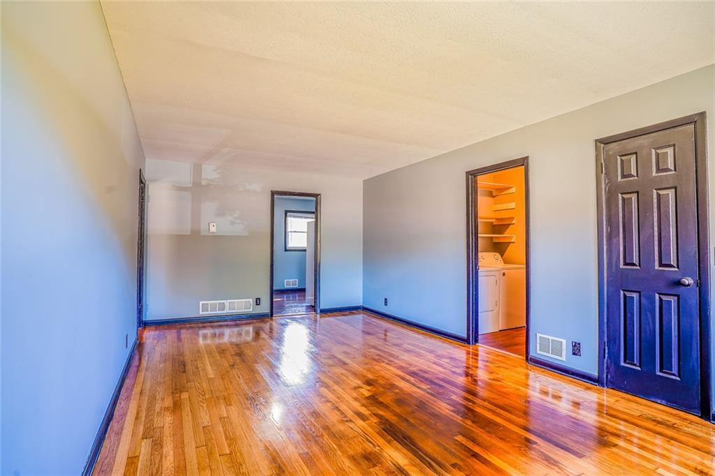 2877 Whispering Hills Drive, Unit 2877 Atlanta, GA 30341 - Photo 5 of 17 a view of empty room with wooden floor