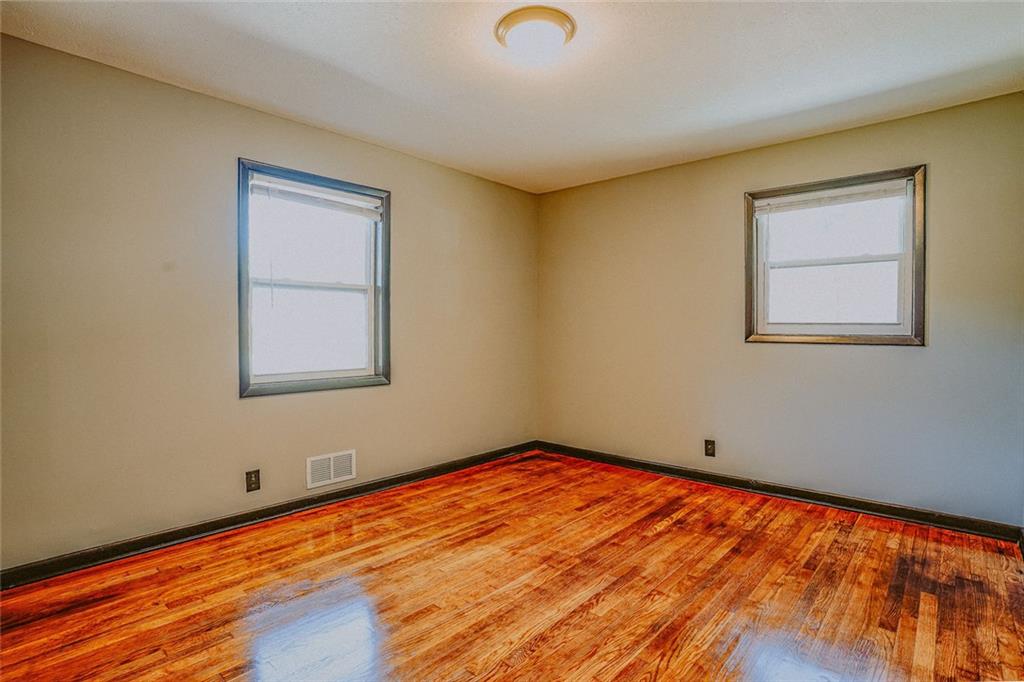 2877 Whispering Hills Drive, Unit 2877 Atlanta, GA 30341 - Photo 9 of 17 a view of a room with wooden floor and fan