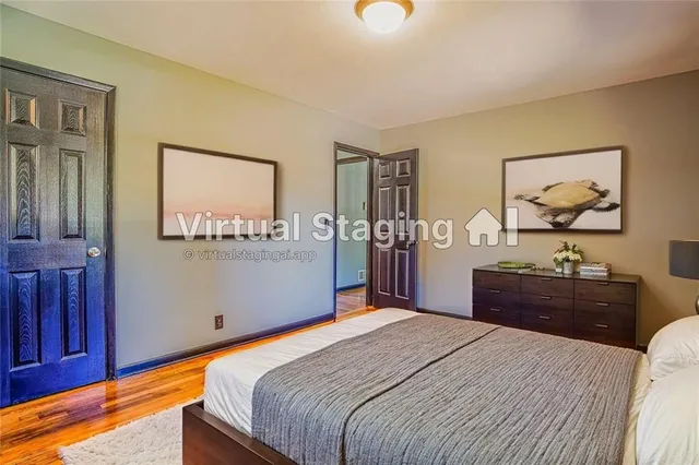 a bedroom with a bed and dresser