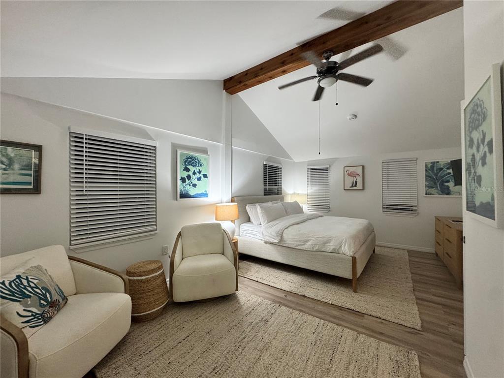 6980 Poinsetta Avenue Longboat Key, FL 34228 - Photo 18 of 18 a bedroom with furniture and wooden floor