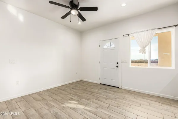 a view of an empty room with a window