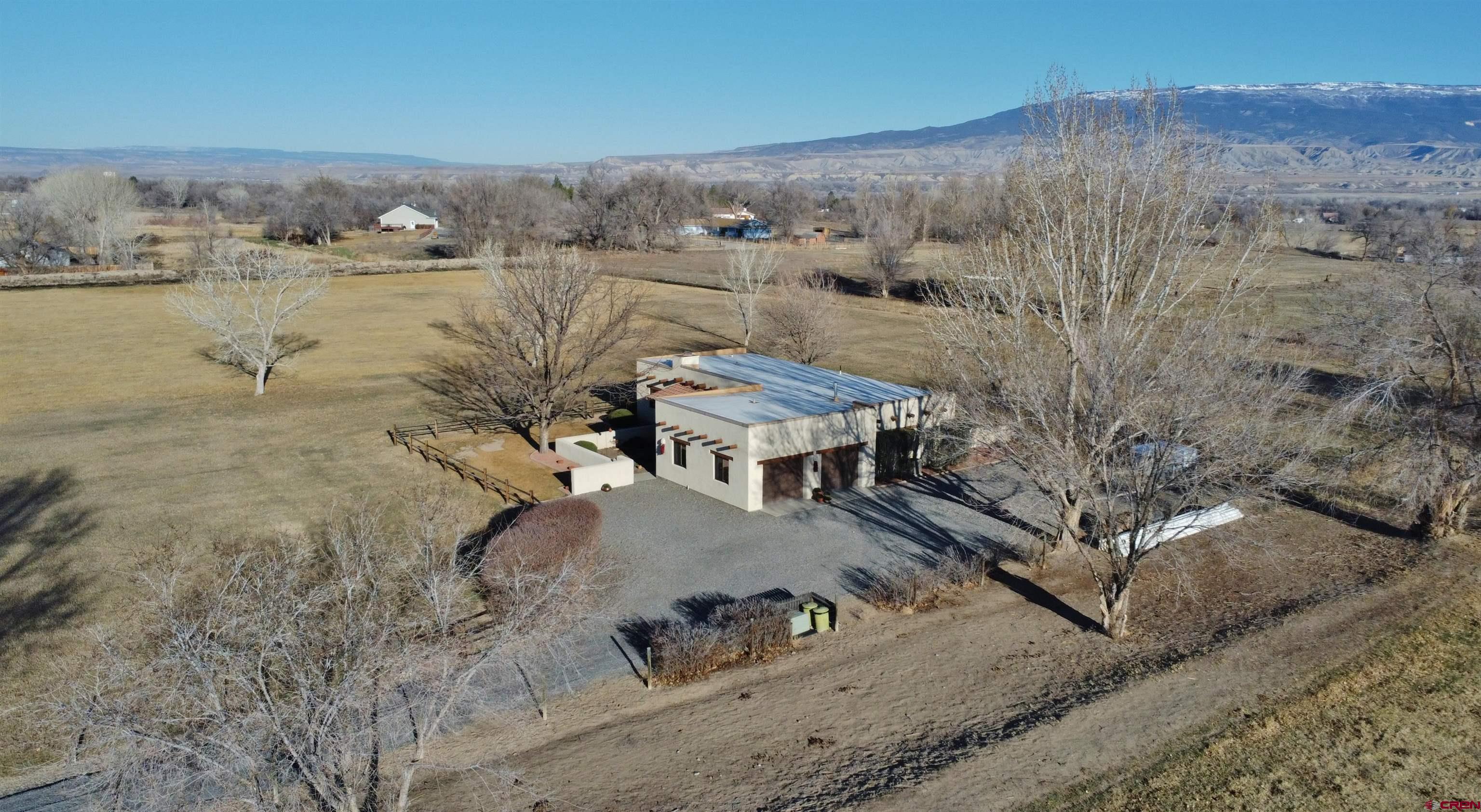 1789 G Road Delta, CO 81416 - Photo 18 of 28 a view of a houses with a yard