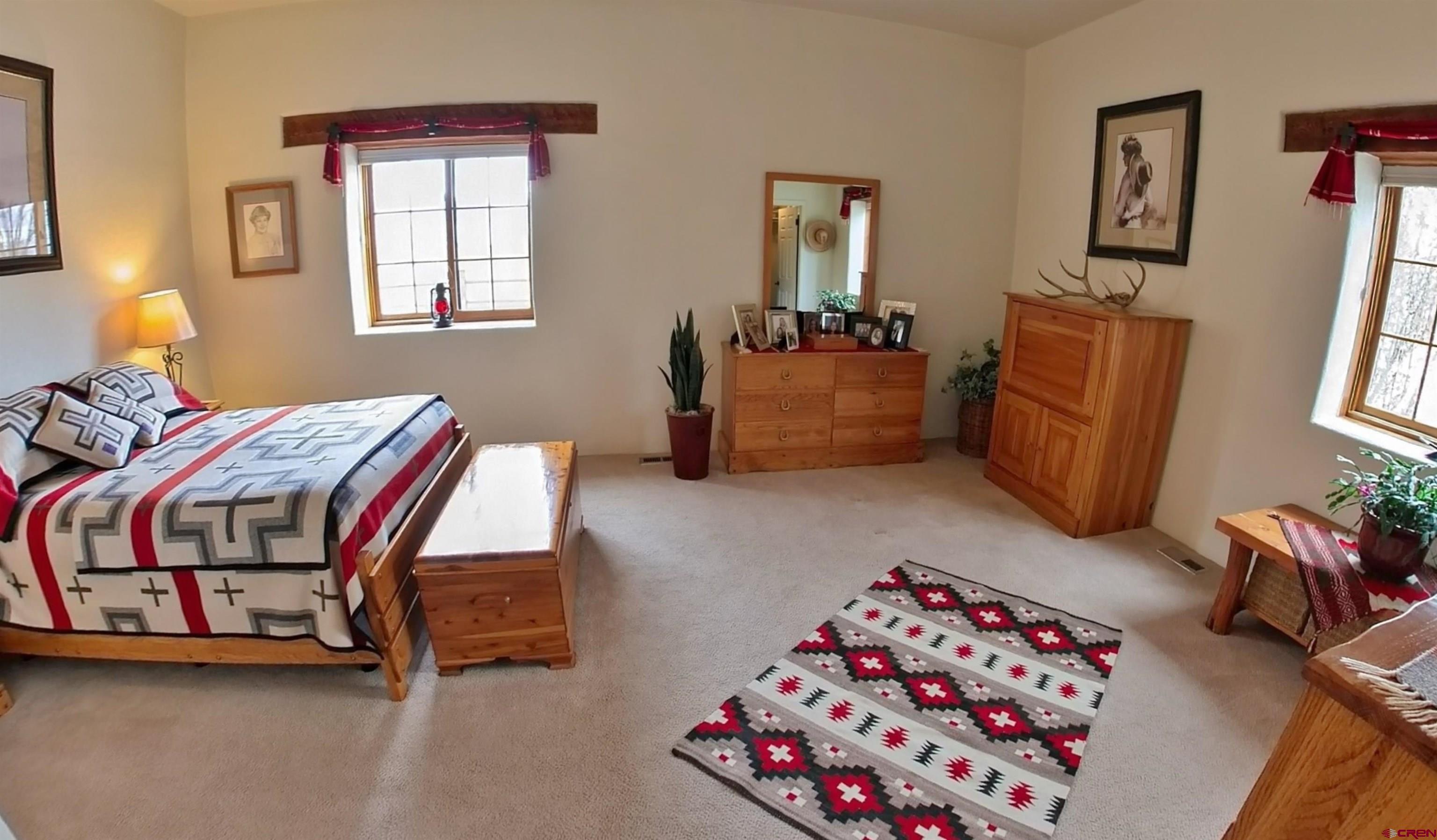 1789 G Road Delta, CO 81416 - Photo 8 of 28 a bedroom with bed and a window