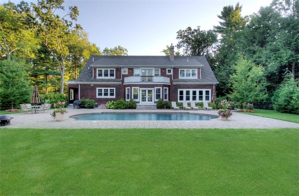 60 Sunset Road Weston, MA 02493 - Photo 3 of 17 a front view of a residential houses with yard and green space