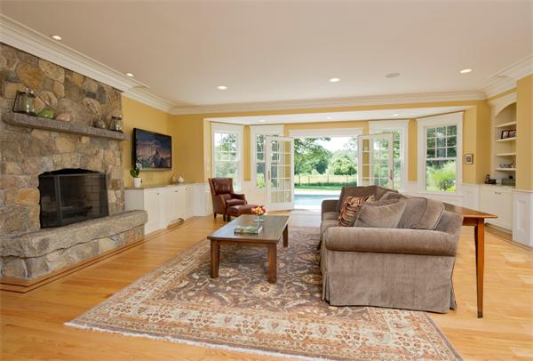 60 Sunset Road Weston, MA 02493 - Photo 5 of 17 a living room with fireplace furniture and a flat screen tv