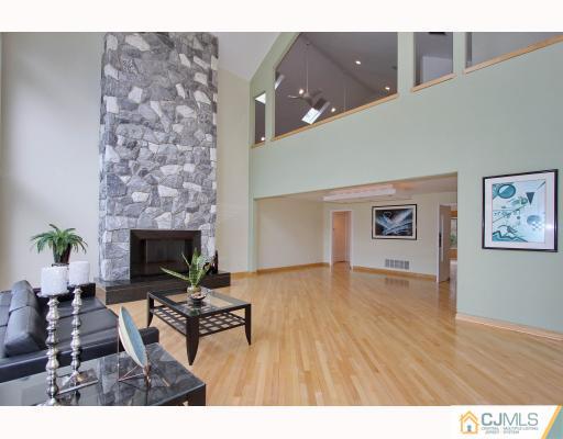 2 Wendover Road Edison, NJ 08820 - Photo 2 of 10 a living room with furniture and a fireplace