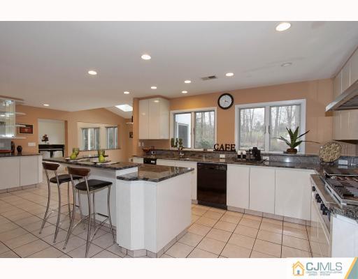 2 Wendover Road Edison, NJ 08820 - Photo 4 of 10 a kitchen with lots of counter top space and appliances