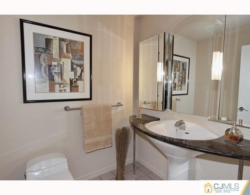 2 Wendover Road Edison, NJ 08820 - Photo 7 of 10 a bathroom with a sink and a mirror