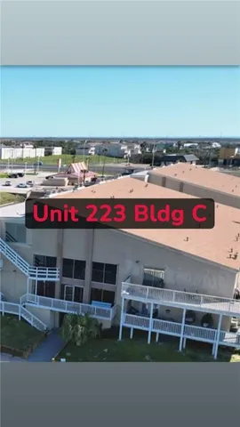 an aerial view of a house with a lake view