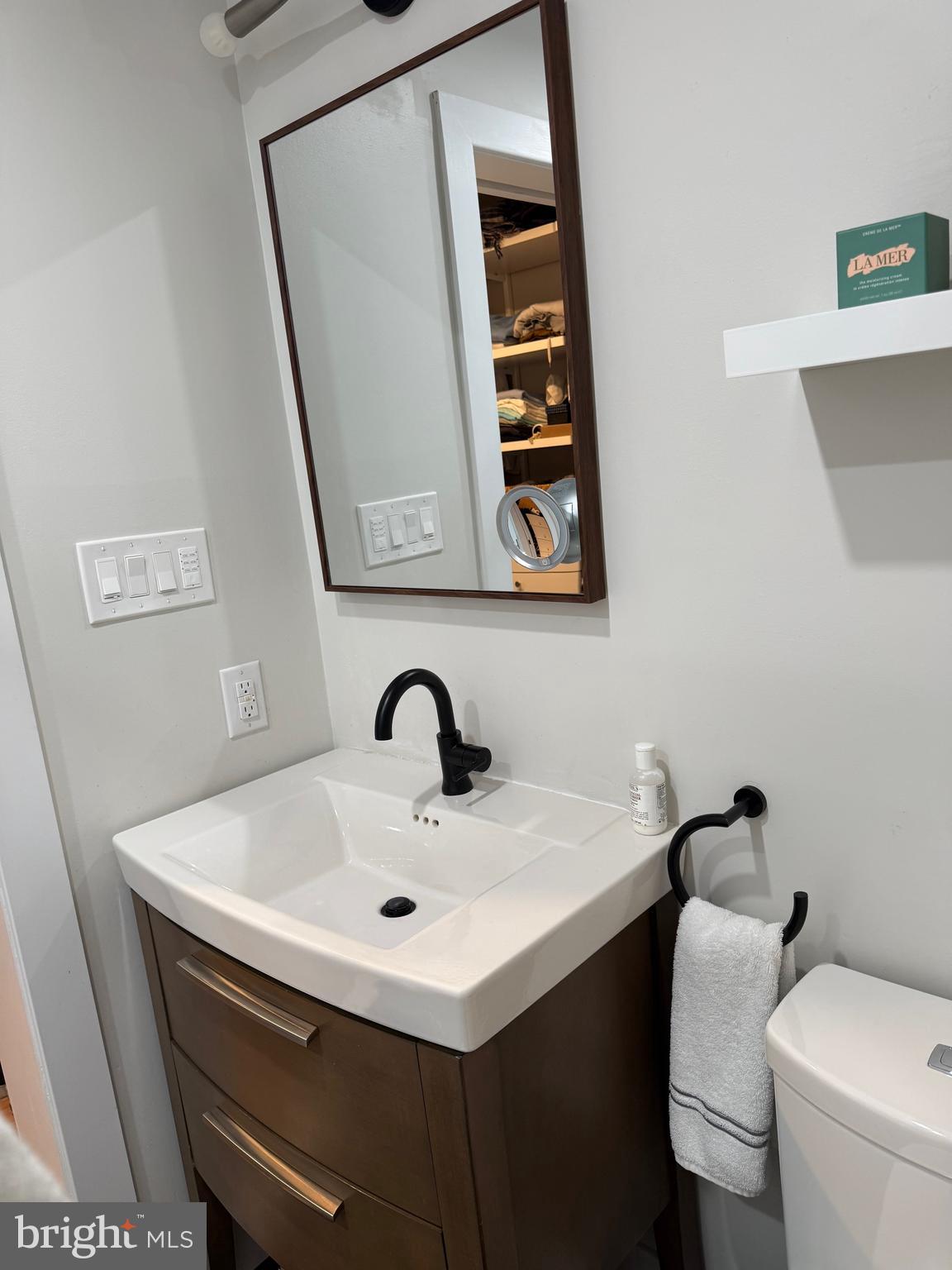 411 Conestoga Road, Unit 22 Devon, PA 19333 - Photo 11 of 14 a bathroom with a sink toilet and mirror