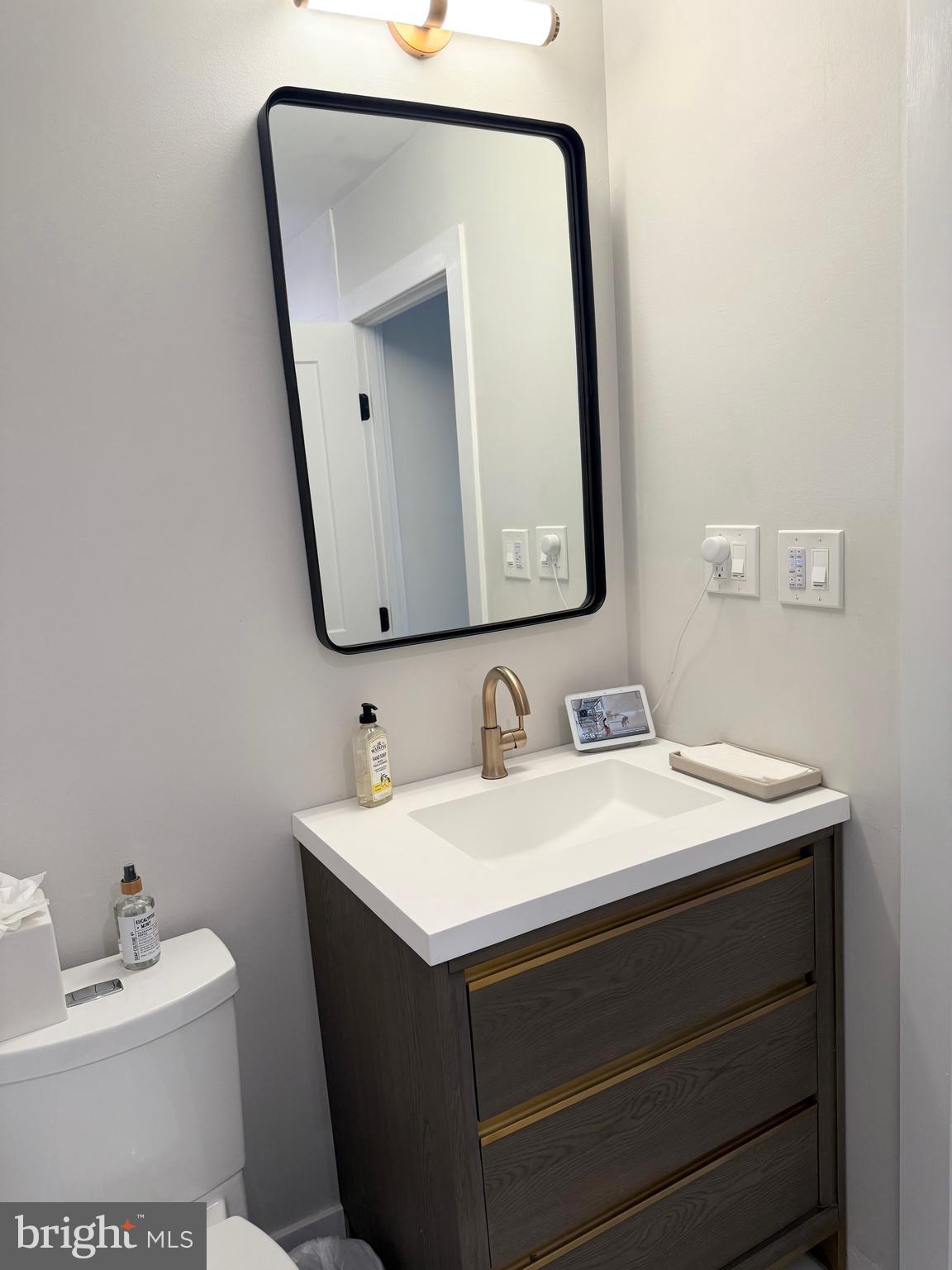 411 Conestoga Road, Unit 22 Devon, PA 19333 - Photo 13 of 14 a bathroom with a sink and a mirror
