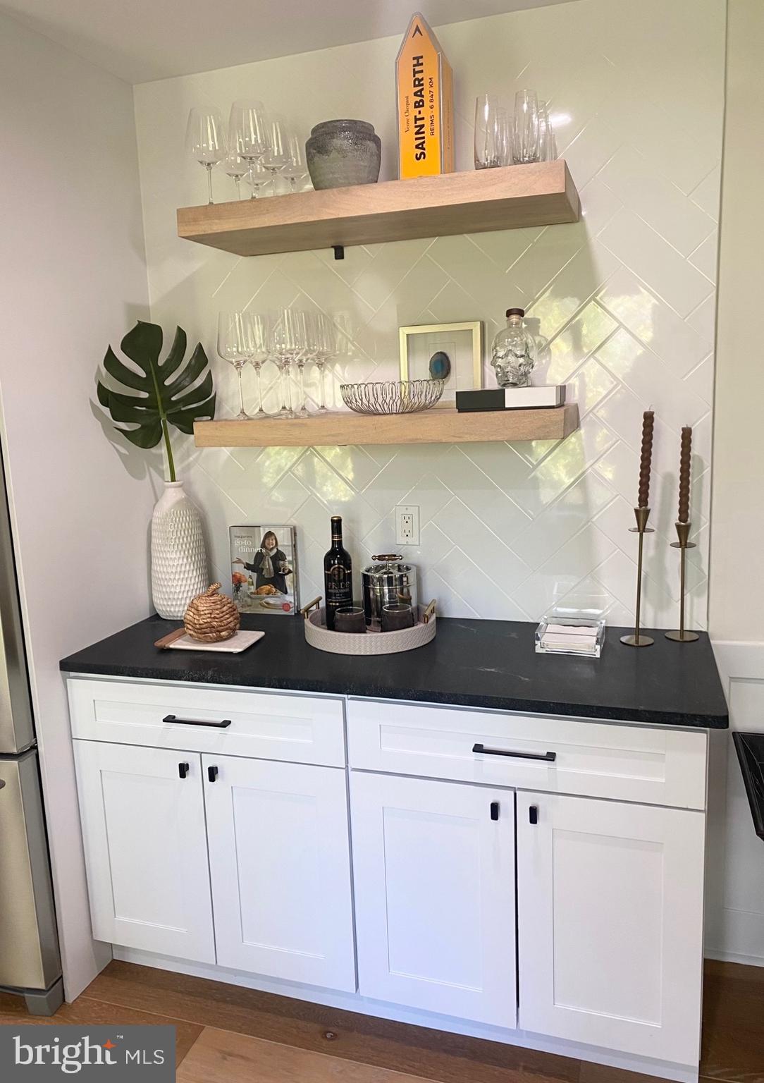 411 Conestoga Road, Unit 22 Devon, PA 19333 - Photo 5 of 14 a bunch of white cabinets and a wooden floor