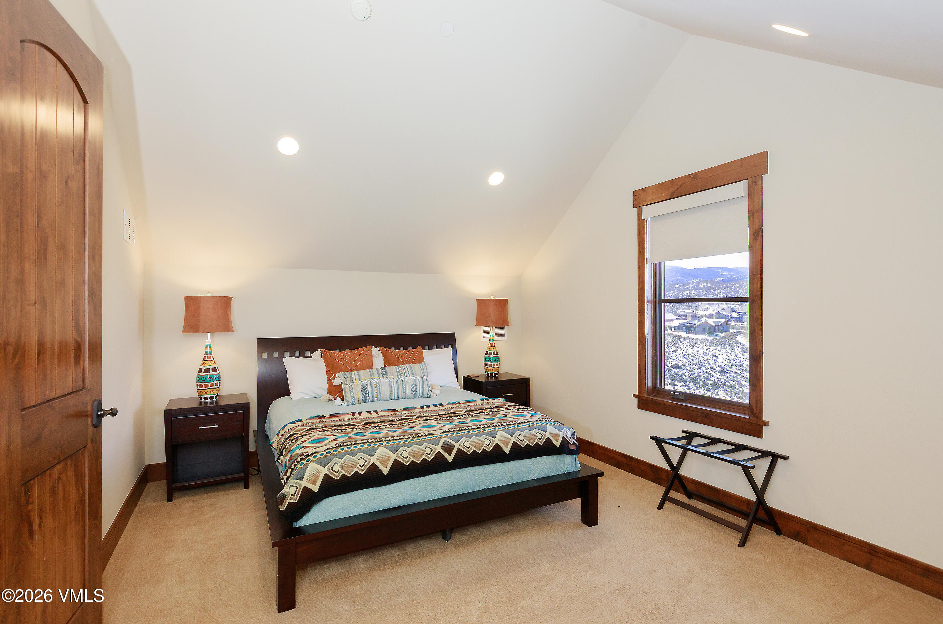 2753 East Haystacker Drive Eagle, CO 81631 - Photo 28 of 41 a bedroom with a bed and a window