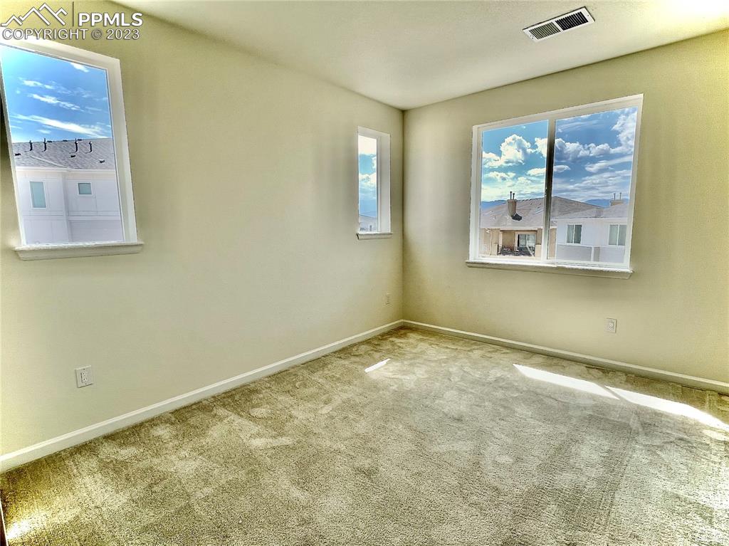 3865 Presidio Point, Unit 202 Colorado Springs, CO 80920 - Photo 12 of 30 a view of an empty room with a window
