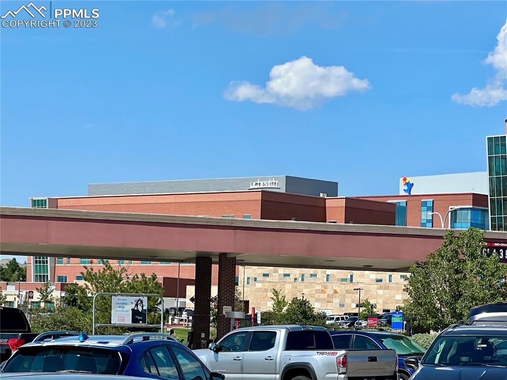 3865 Presidio Point, Unit 202 Colorado Springs, CO 80920 - Photo 25 of 30 a front view of a building with garden
