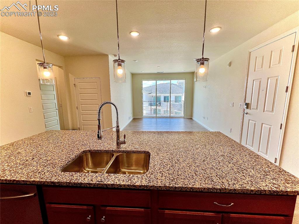 3865 Presidio Point, Unit 202 Colorado Springs, CO 80920 - Photo 6 of 30 a kitchen with sink and window