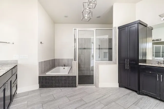 a room with a walk in closet and wooden floor