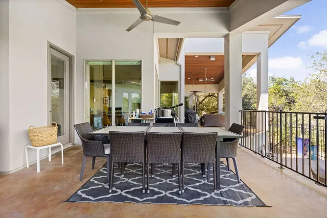 a view of a balcony with furniture
