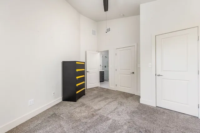 a bathroom with a granite countertop sink a mirror and a bathtub