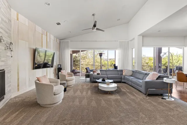 a living room with furniture and a large window