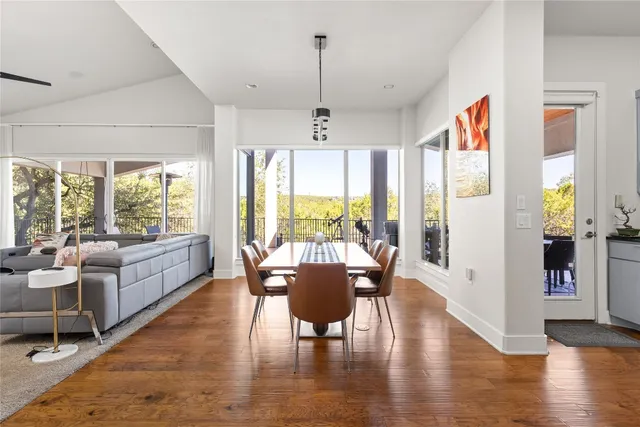 a view of a dining room with furniture window and wooden floor