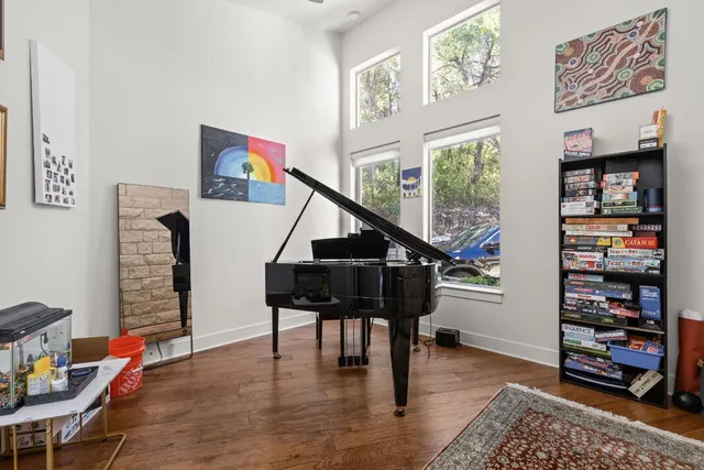a living room with furniture and a book shelf