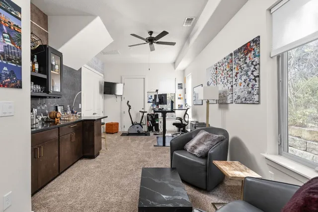 a living room with furniture and a large window