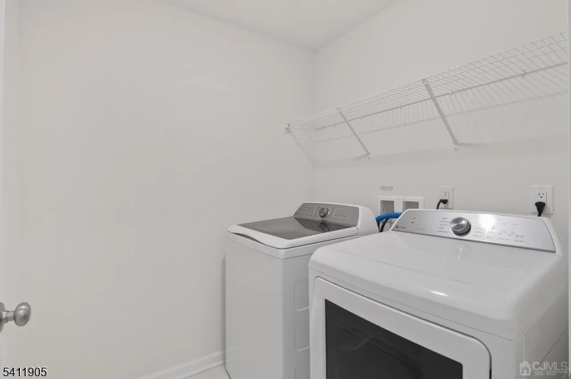 735 Station Road Dunellen, NJ 08812 - Photo 14 of 36 a utility room with dryer and washer