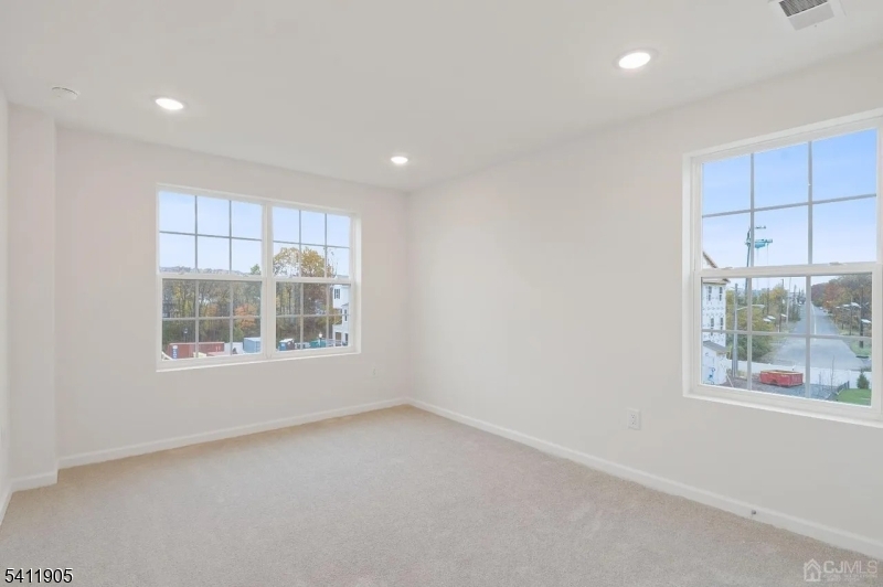 735 Station Road Dunellen, NJ 08812 - Photo 20 of 36 an empty room with windows