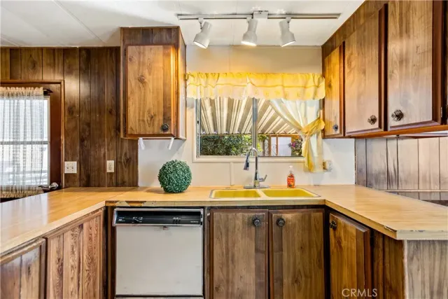 a kitchen with a sink and a window