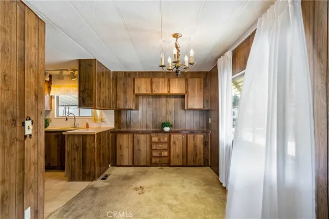 a view of a hallway with a chandelier