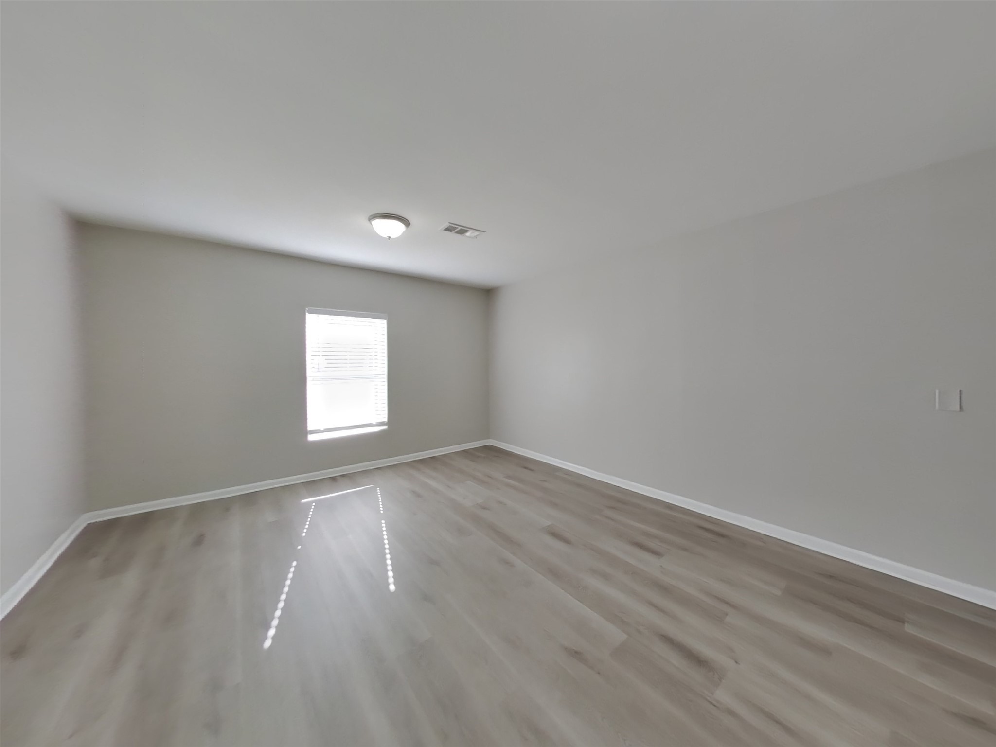 623 Walston Lane Houston, TX 77060 - Photo 16 of 21 wooden floor in an empty room with a window