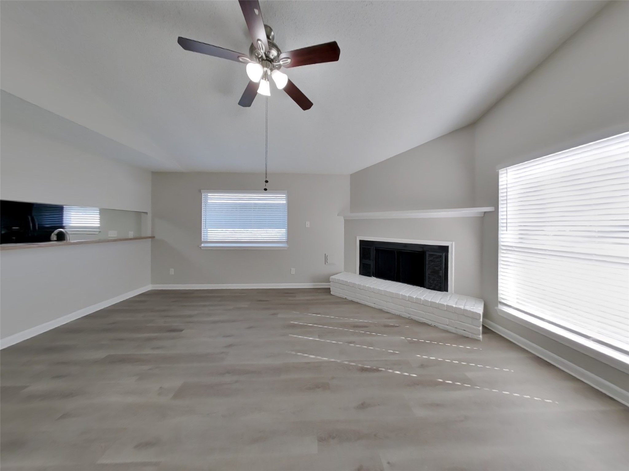 623 Walston Lane Houston, TX 77060 - Photo 3 of 21 a view of an empty room with a fireplace and a window