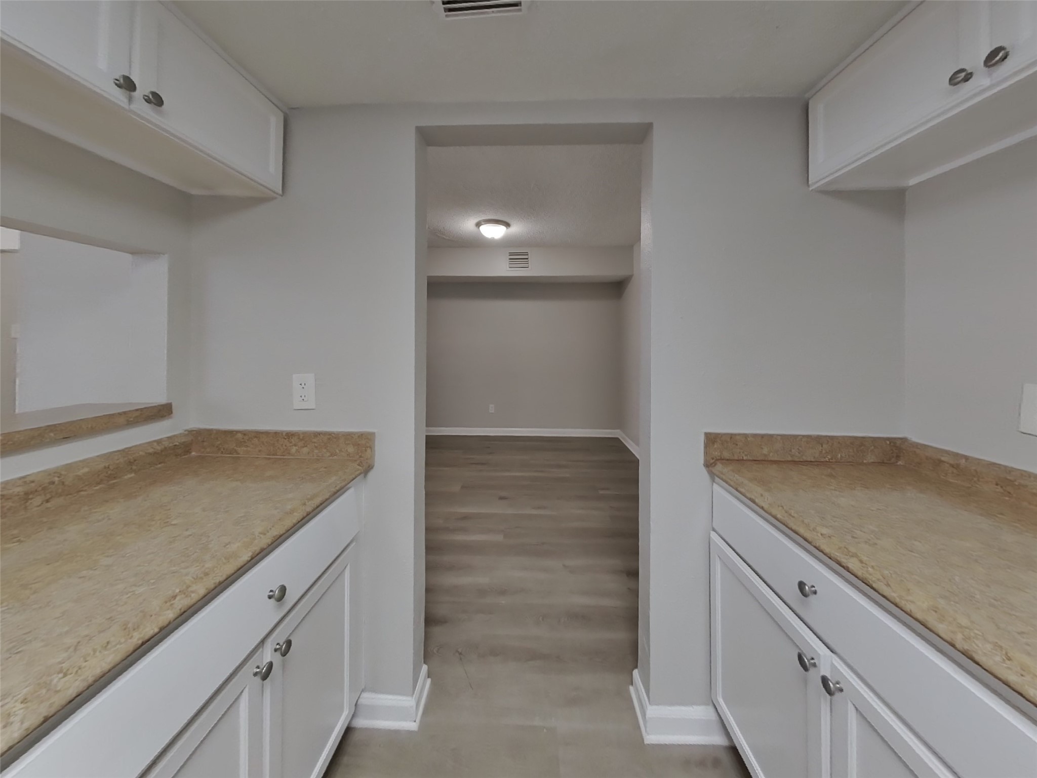 623 Walston Lane Houston, TX 77060 - Photo 6 of 21 a kitchen with granite countertop white cabinets and a sink