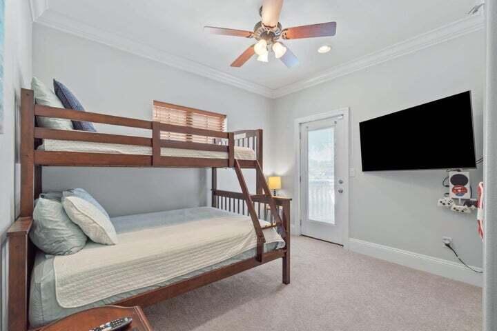 1900 Baytowne Loop Miramar Beach, FL 32550 - Photo 23 of 44 a bedroom with a bed and a flat screen tv