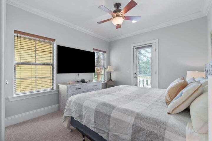 1900 Baytowne Loop Miramar Beach, FL 32550 - Photo 28 of 44 a bedroom with a bed tv and a window