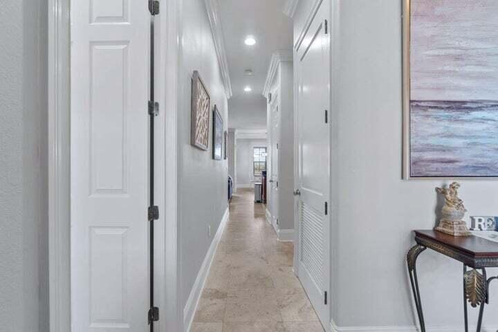1900 Baytowne Loop Miramar Beach, FL 32550 - Photo 7 of 44 a view of a hallway with wooden floor