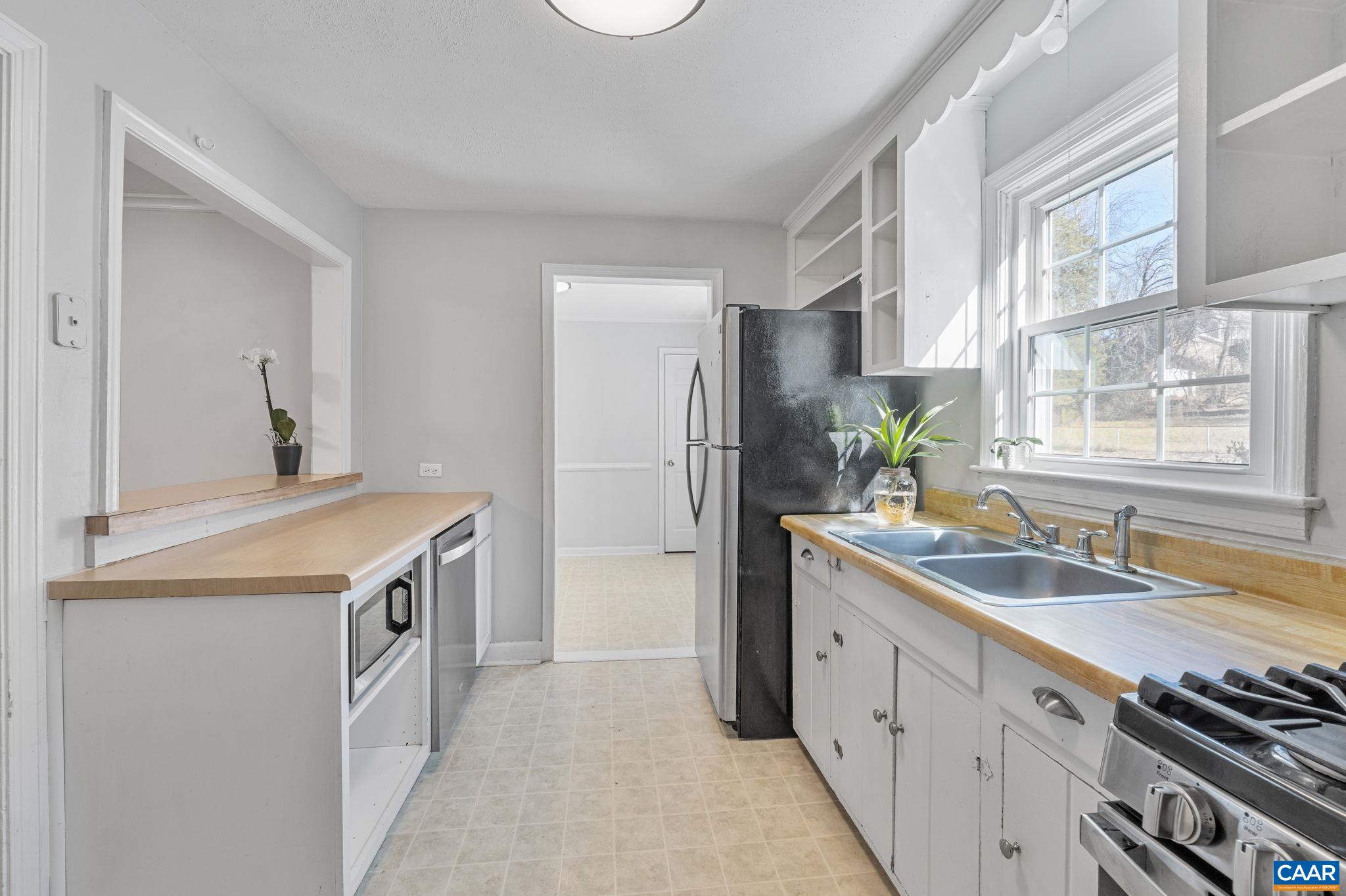 1007 Montrose Avenue Charlottesville, VA 22902 - Photo 13 of 37 a kitchen with a sink stove top oven and refrigerator