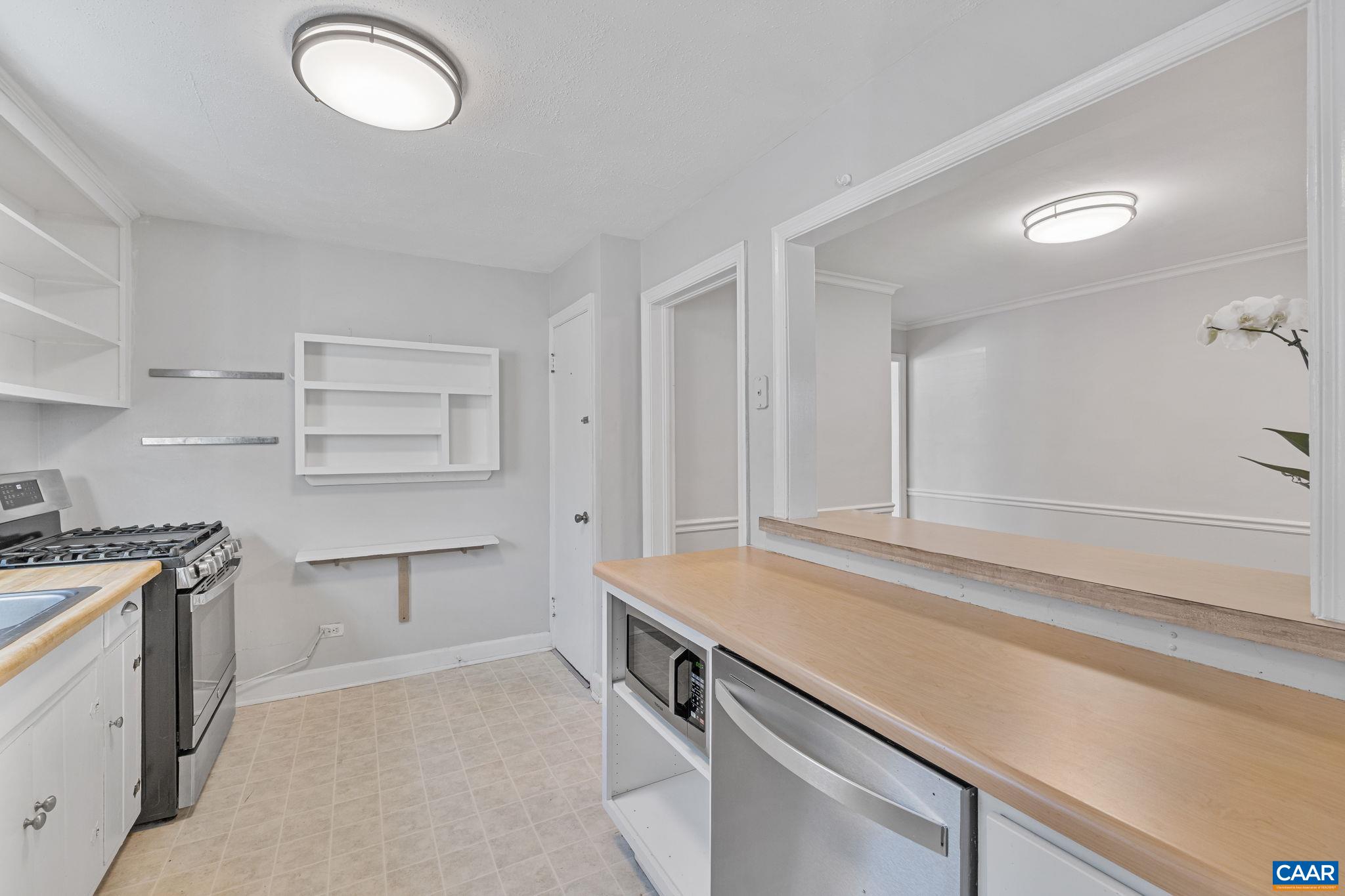 1007 Montrose Avenue Charlottesville, VA 22902 - Photo 14 of 37 a kitchen with white cabinets and sink