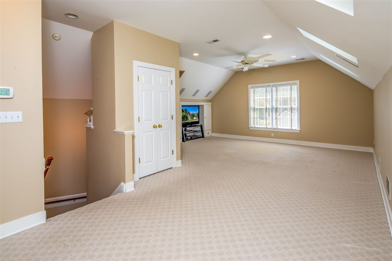 2709 Amstel Way Raleigh, NC 27613 - Photo 25 of 30 Upgrades include skylights with adjustable blinds, ceiling fan, recessed lighting and closet space! Can be used as bonus room, bedroom, office or entertainment center! Custom built-in cabinetry and shelving can be used as workspace or homework nook! Third Floor Flex Space