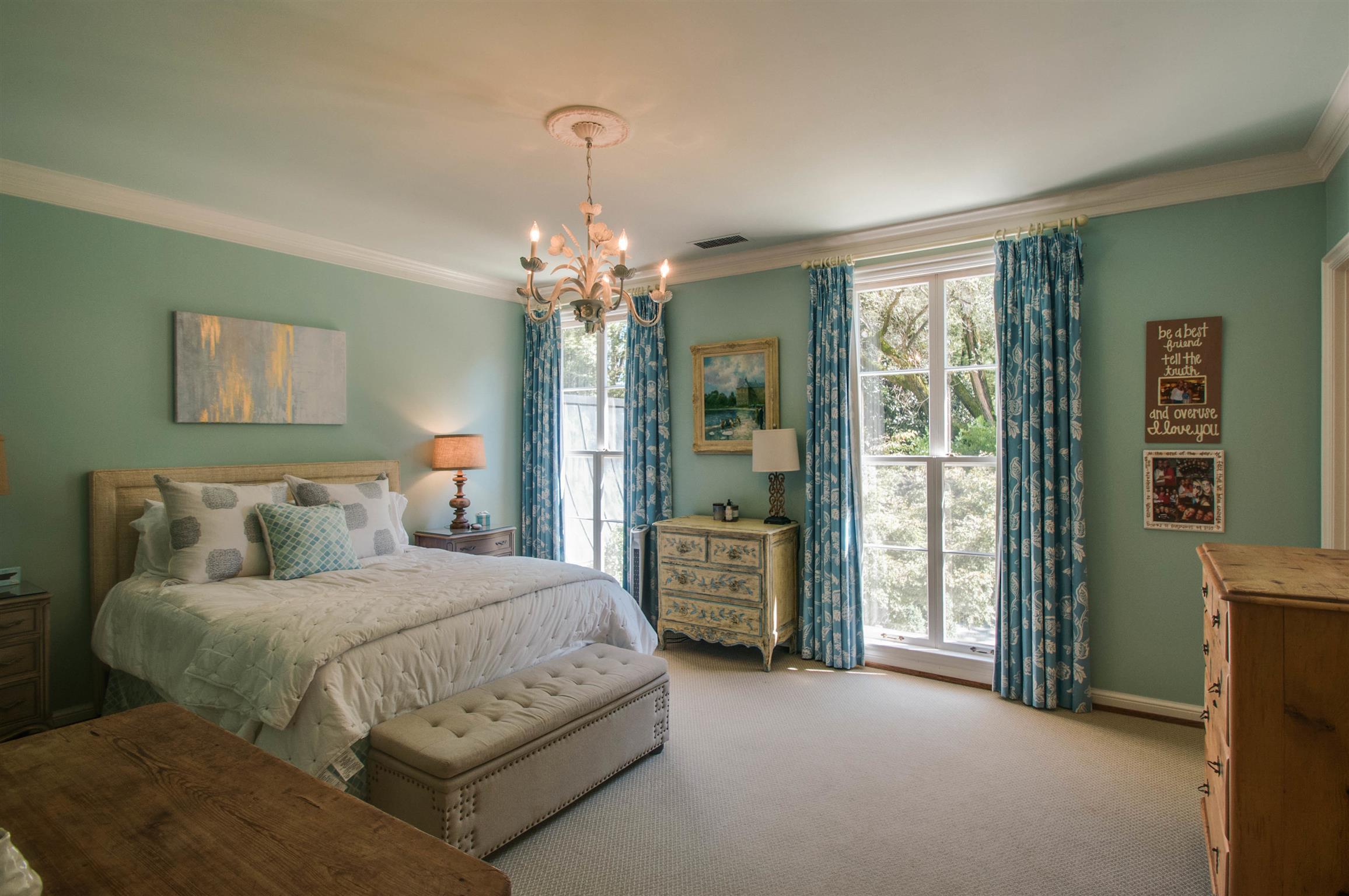 4727 Post Road Nashville, TN 37205 - Photo 21 of 28 a bedroom with a large bed and a chandelier