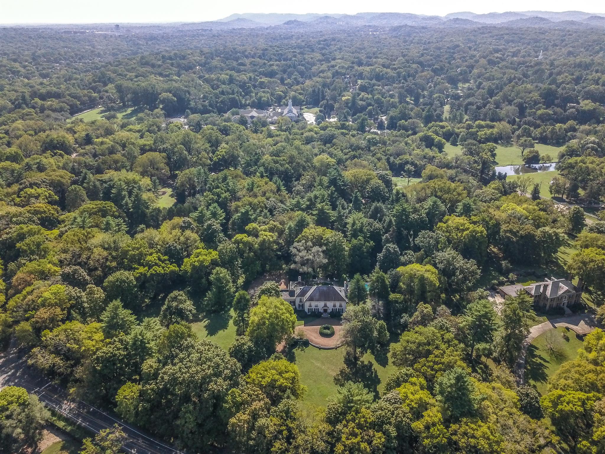 4727 Post Road Nashville, TN 37205 - Photo 28 of 28 a view of a house with a street lush green forest