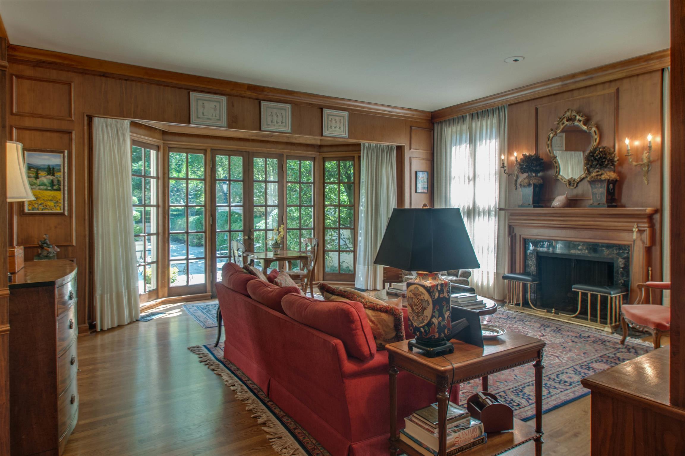 4727 Post Road Nashville, TN 37205 - Photo 9 of 28 a living room with furniture a fireplace and a floor to ceiling window