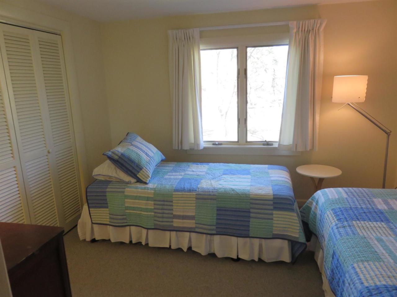 126 Wading Place Road Mashpee, MA 02649 - Photo 18 of 27 a bedroom with a bed and a window