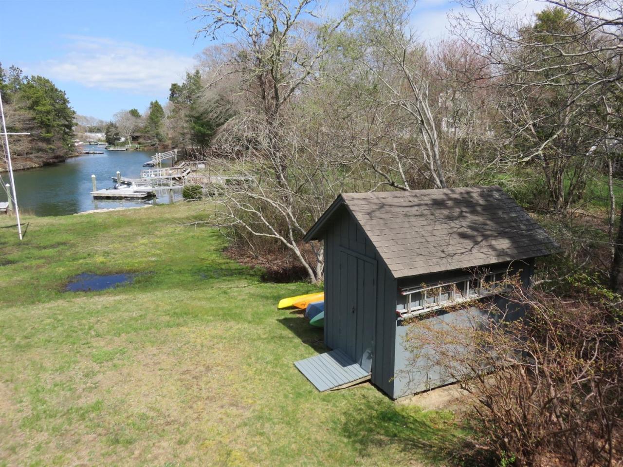 126 Wading Place Road Mashpee, MA 02649 - Photo 5 of 27 a view of a house with a yard