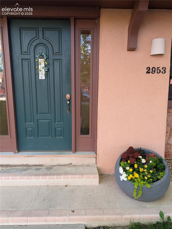 2953 Mesa Road, Unit B Colorado Springs, CO 80904 - Photo 1 of 23 a view of a wooden door of a brick house