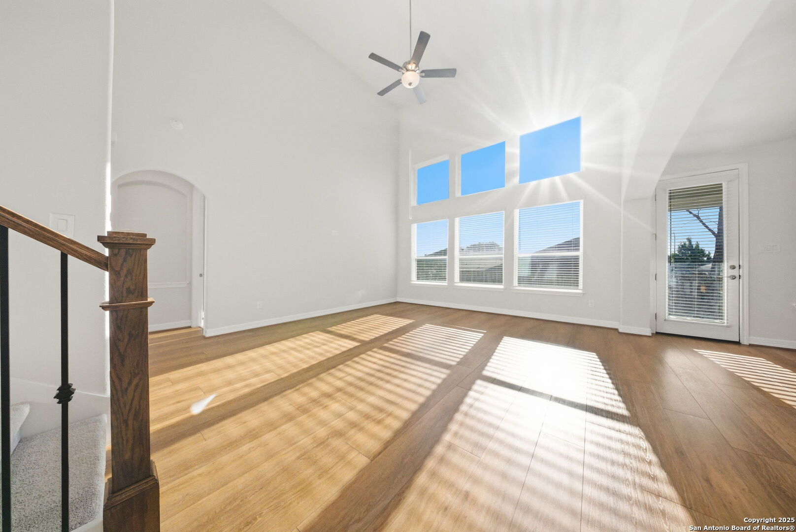 662 Hidden View Street New Braunfels, TX 78130 - Photo 11 of 48 a view of an empty room with a window and wooden floor