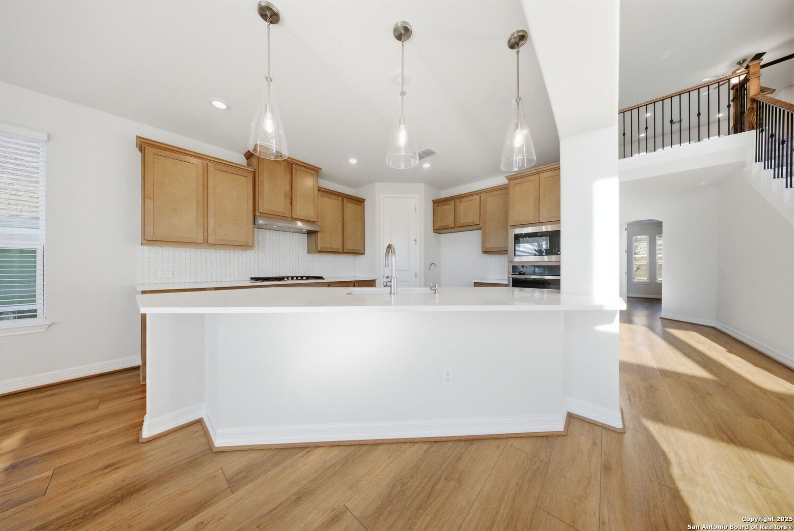 662 Hidden View Street New Braunfels, TX 78130 - Photo 18 of 48 a large kitchen with stainless steel appliances granite countertop a refrigerator a oven and a wooden floors